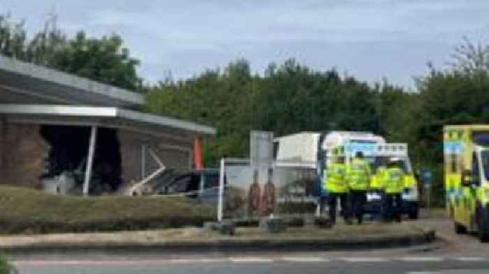 Vehicle crashes into car wash at service station