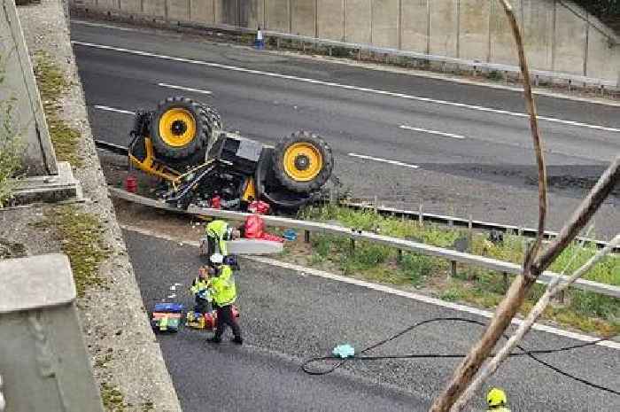 Kent Police gives update on driver after tractor falls off bridge on to M20