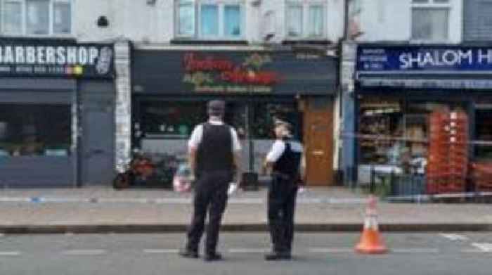 Boy and man held over restaurant 'arson attack'