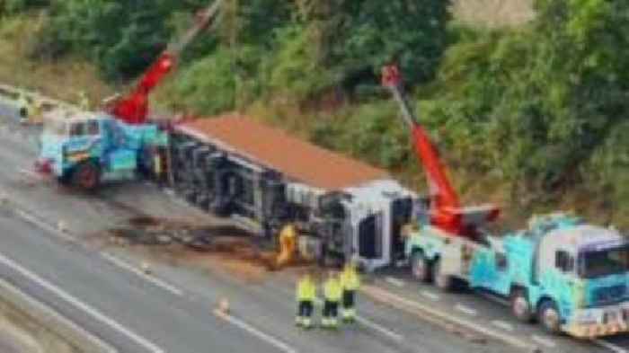 Motorway closed by overturned lorry fuel spill
