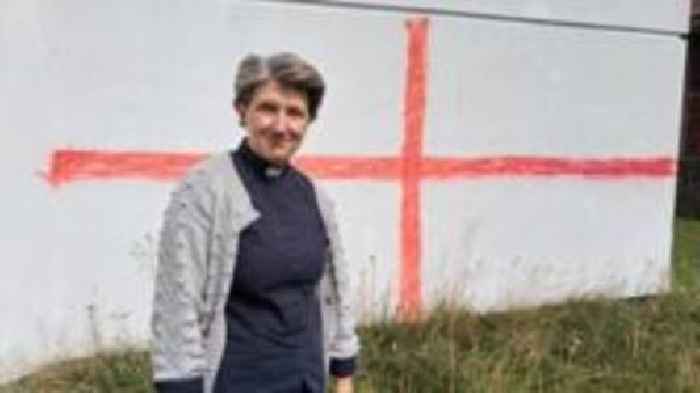 Flag graffiti is attempt to intimidate, says vicar