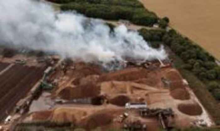 Crews on standby after 400,000-tonne bark blaze