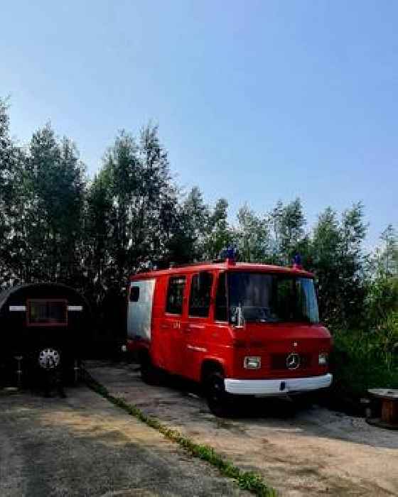 Old Mercedes Fire Truck Is Now a Tiny Log Cabin for Simple, Off-Grid Living