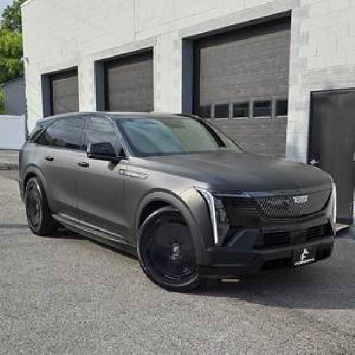Satin Black Caddy Escalade IQ Just Needs a Set of Gloss Black Full-Face Rims to Stand Out 