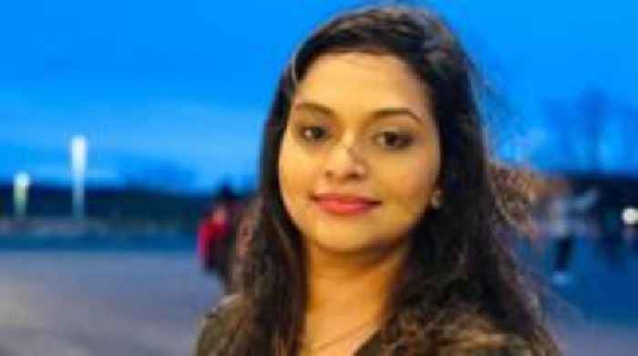 Body of 'cherished' woman found between parked cars