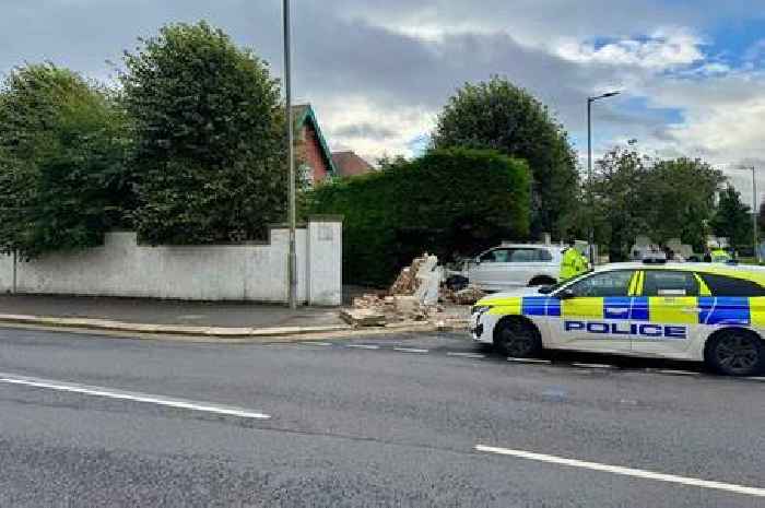Ayrshire road closed after car hits garden wall