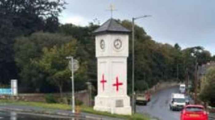 War memorial graffitied with St George's Cross
