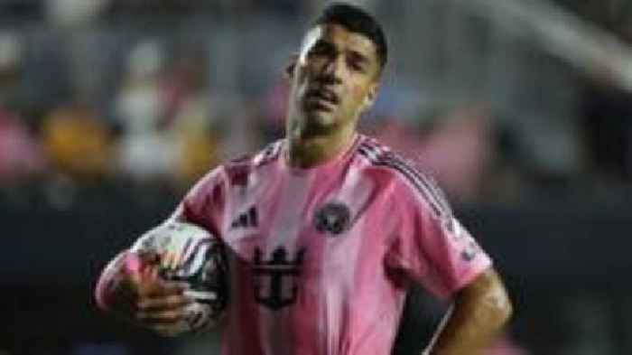 Suarez appears to spit at opposition coach after melee
