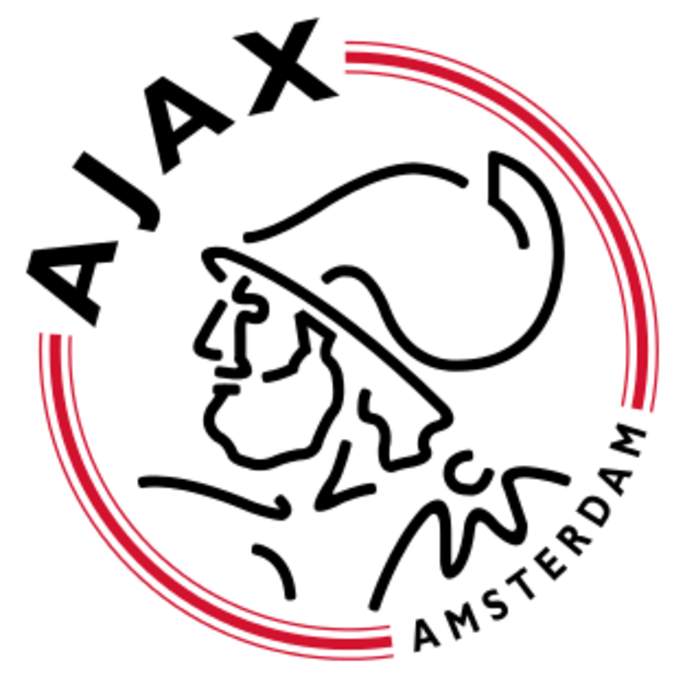 Match abandoned and fans clash with police after flares thrown onto Ajax pitch