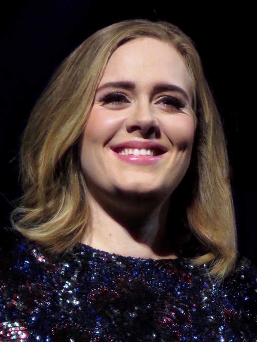 Adele shows off new look in stunning gown at Drake's party: 'I used to cry but now I sweat'