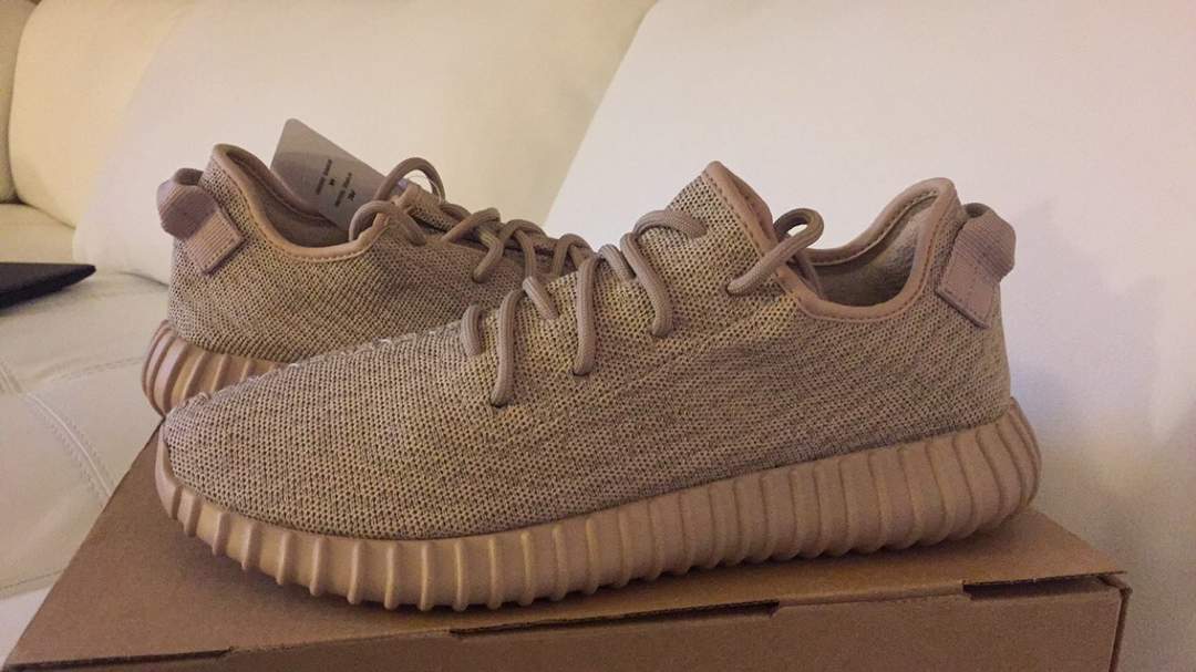 Kanye West's Yeezy trainers sell for record $1.8m
