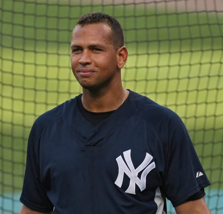 Alex Rodriguez poses with the Porsche he once gifted ex Jennifer Lopez