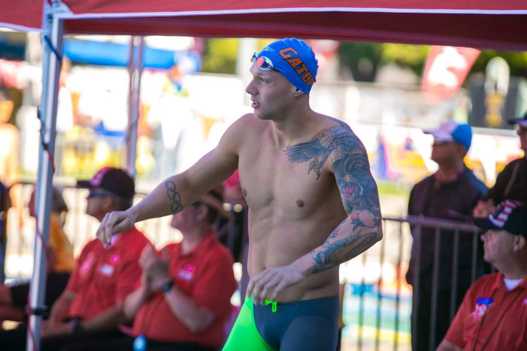 Caeleb Dressel holds off 42-year-old Nicholas Santos to retain 50m butterfly title