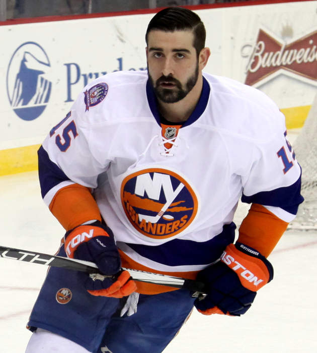New York Islanders' Cal Clutterbuck slashed on wrist by skate after he checks Boston Bruins' Patrice Bergeron