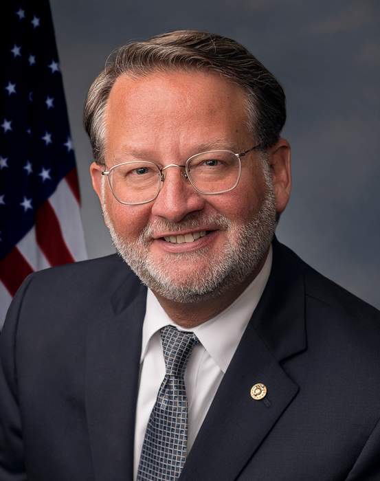 Sen. Gary Peters reflects on the Senate floor after a deadly Michigan high school shooting