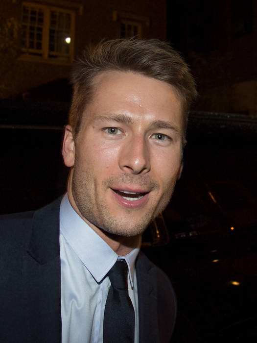 Glen Powell's Parents Hilariously Troll Him At 'Hit Man' Premiere