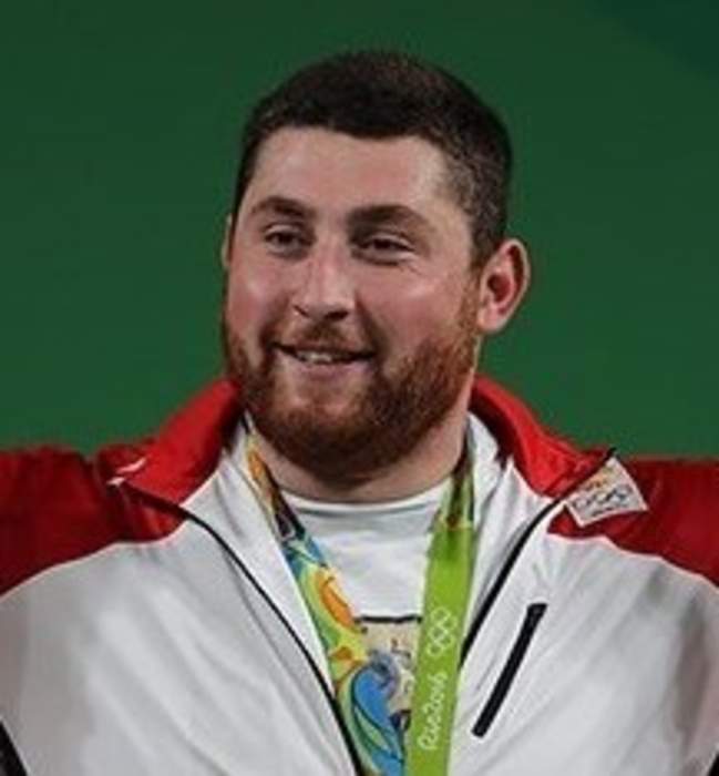 Georgian weightlifter breaks three world records, lifts nearly 1,100 pounds at Olympics