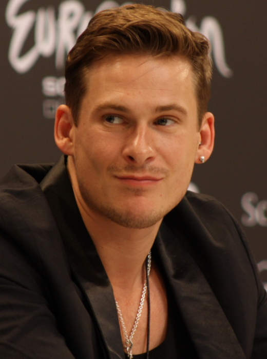 Blue singer Lee Ryan 'physically assaulted' on plane after 'putting feet on seat'