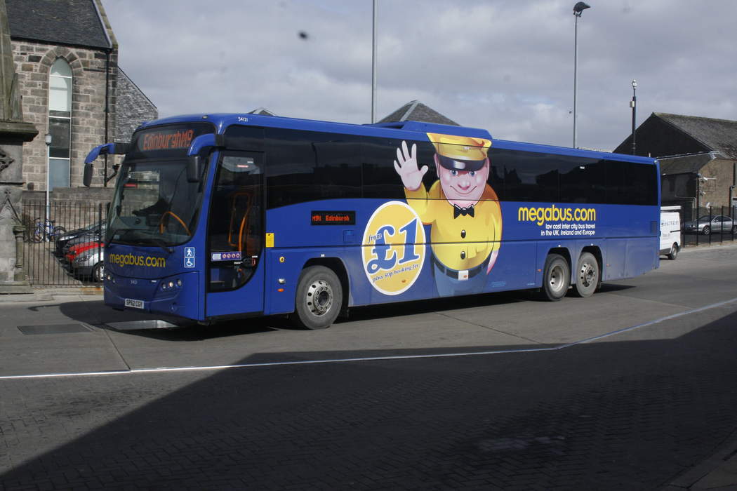 Megabus goes up in flames after blown tire
