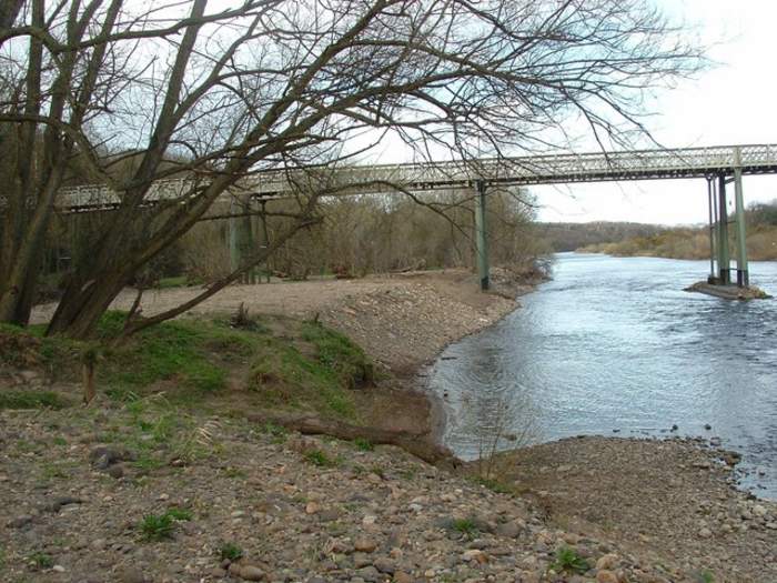 Boy remains in critical condition after river death