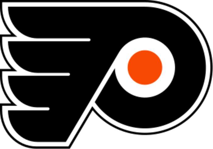 Police K-9 Craps All Over Philadelphia Flyers' Center-Ice Logo