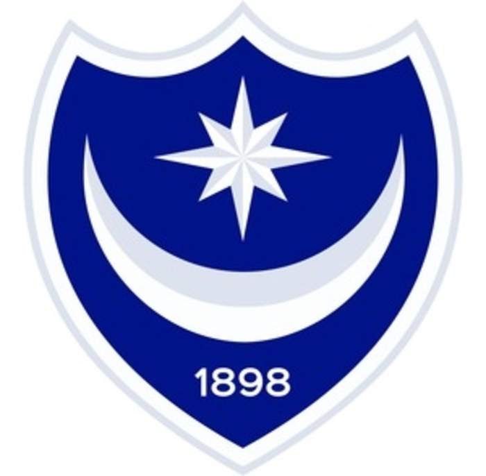 Portsmouth seal promotion with late win over Barnsley