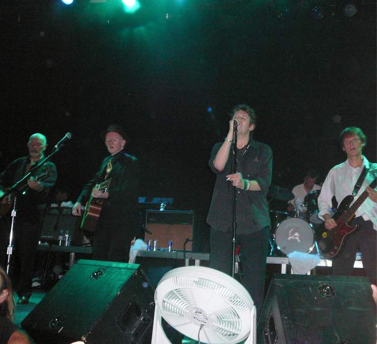 The Pogues frontman pictured in hospital - as bandmates visit singer