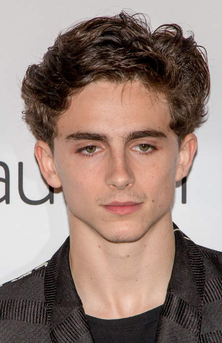 Timothée Chalamet Attends Lakers Game With His Dad, Kylie Jenner MIA