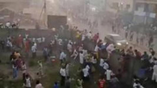 135 killed in football stadium crush, Guinea rights groups say