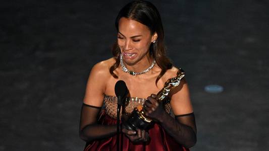 ‘Proud child of immigrant parents’: Zoe Saldana cries while accepting her Oscar