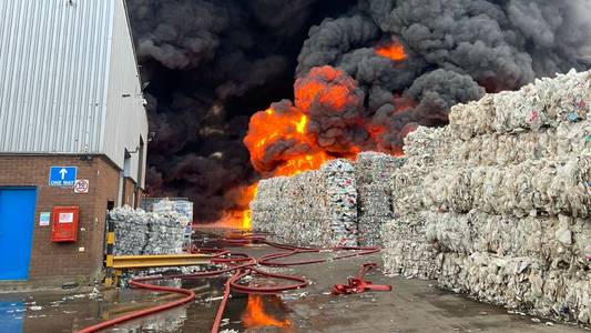 Firefighters battling large blaze at recycling warehouse