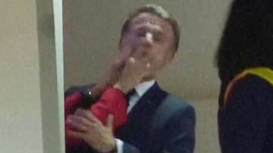 Macron pushed in face by wife - as his office plays down video of 'squabble'