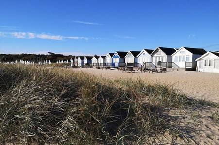 The incredibly beautiful South East seaside village with sandy beach, cute huts and intriguing history of smuggling