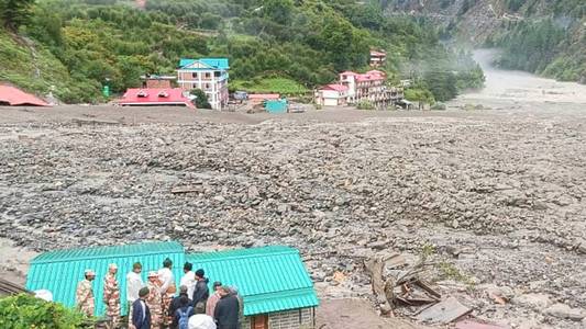 Dozens believed to be trapped under rubble after flash floods in northern India
